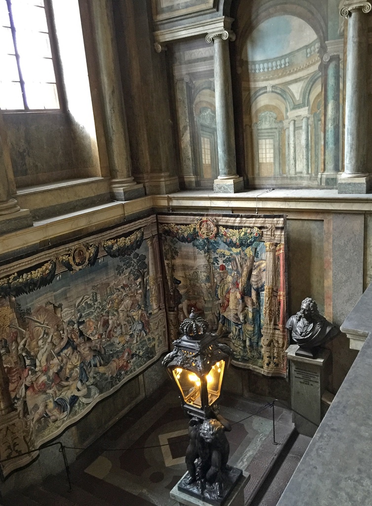 Tapestries, Bust and Lamp in Stairwell